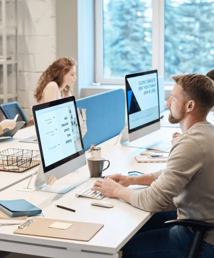 People working at desks in an open office