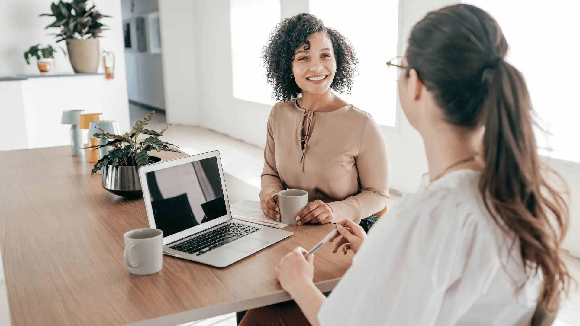 Two colleagues talking in an office